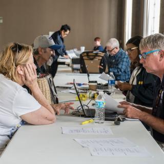 FEMA and SBA staffers work with flood survivors at the Disaster Recovery Center in Neosho