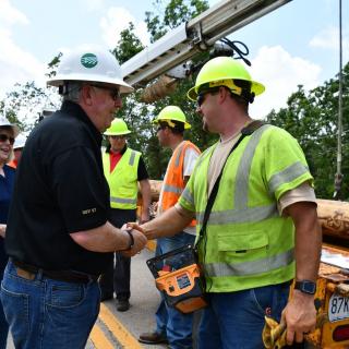 Governor Mike Parson meets with utility workers restoring services following the tornado in Jefferson City.